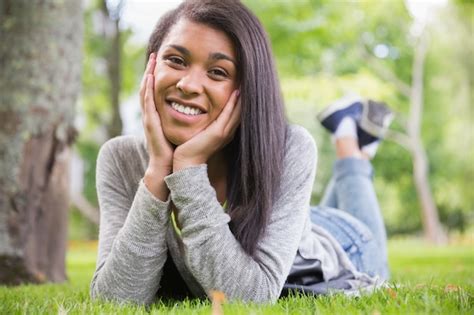 Premium Photo Pretty Brunette Smiling At Camera In Park