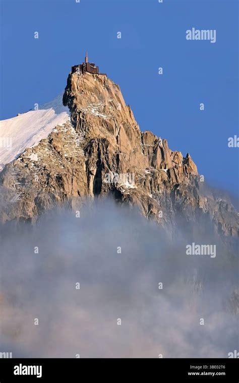 summit  aiguille du midi  alpine buildings emerging   mist