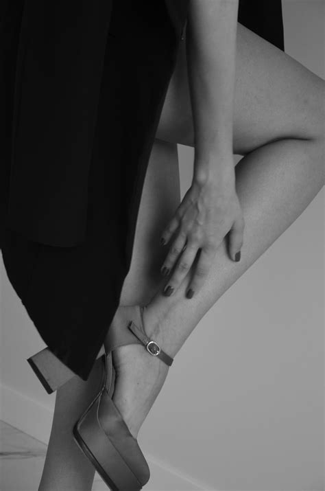 Woman Sitting Barefoot And In Black Outfit · Free Stock Photo