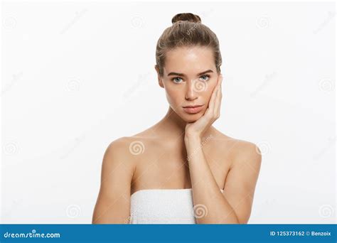 Beautiful Girl With Dark Brown Hair Fixed Behind Big Eyes Dark Eyebrows And Naked Shoulders