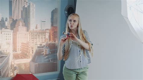 Happy Blonde Model Smiling And Posing With Makeup Brushes During Photo Shoot Stock Image Image