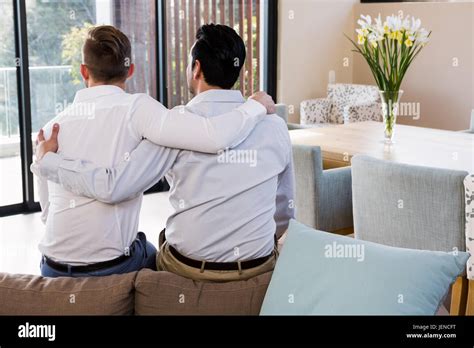 Rear View Of Gay Couple With Arms Around Stock Photo Alamy