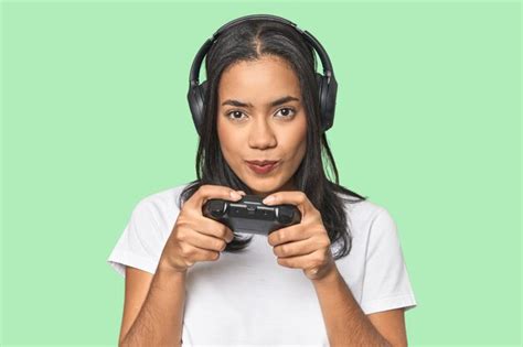 Premium Photo Latina Gamer Using A Controller In Studio
