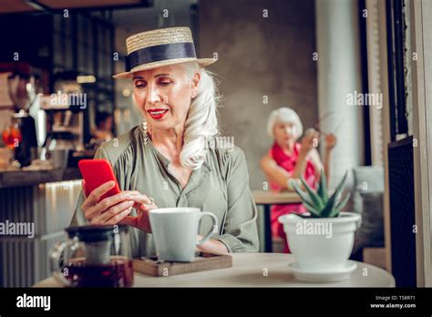 Beautiful Nice Blonde Woman Checking Her Messages Stock Photo Alamy