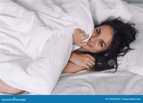 Portrait Of A Nude Brunette Girl Lying In Bed Under A Blanket Stock Photo Image Of Natural