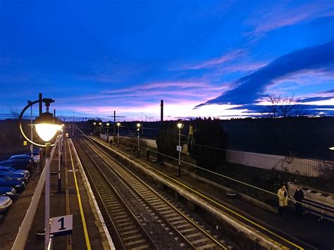 Passengers waiting to commute in to Edinburgh at Drem station this