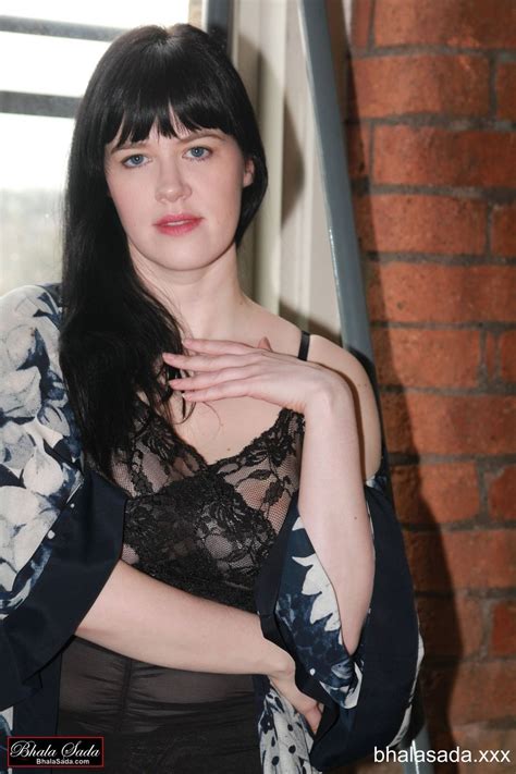 Cute Brunette Chick Showing Her Sexy Legs In Black Stockings Photos