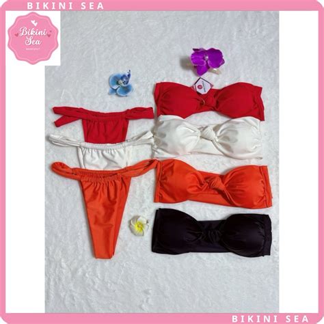 Bikini đồ bơi 2 mảnh áo quây cột dây nơ quần đan dây lọt khe hot trend bikini sea Shopee Việt Nam