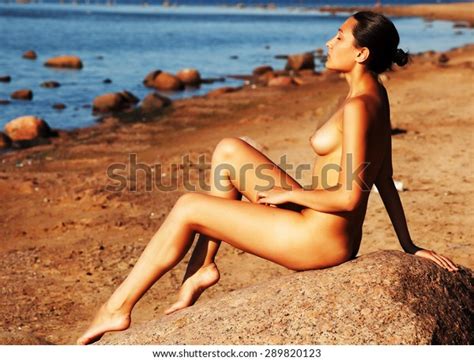 Naked Woman Sitting On Stone Beach Stock Photo Shutterstock