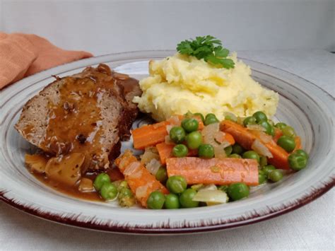 Homemade Meatloaf With Gravy Mashed Potatoes And Carrots And Peas Rfood