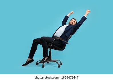 Young Businessman Stretching Comfortable Office Chair Stock Photo ...