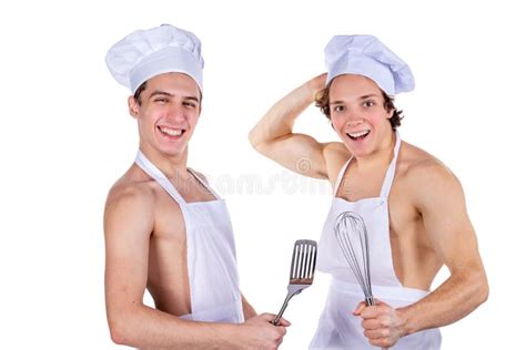 Two Handsome Chefs With Apron On Naked Muscular Body With Kitchen Utensils Isolated On White