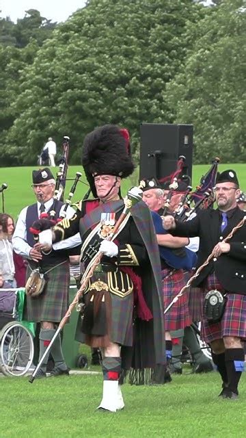 Drum Major Leads The Massed Pipes And Drums Into Arena During 2023 City