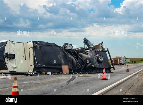 Fifth wheel Recreational Vehicle overturned on a highway with the ...
