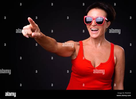 Mature Beautiful Woman With Short Hair Against Black Background Stock Photo Alamy