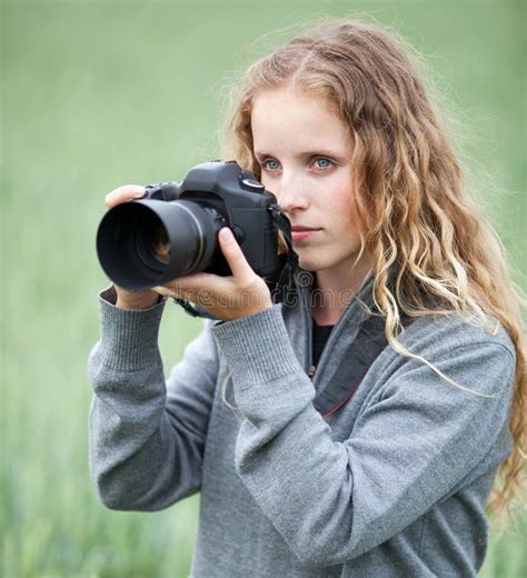 Pretty Young Woman with a DSLR Camera Stock Photo - Image of enjoying, fresh: 15419088