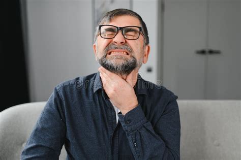Illness And Disease Concept Sick Mature Aged Man Feeling Sore Throat
