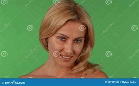 Gorgeous Mature Blond Haired Woman Smiling Seductively To The Camera Stock Photo Image Of