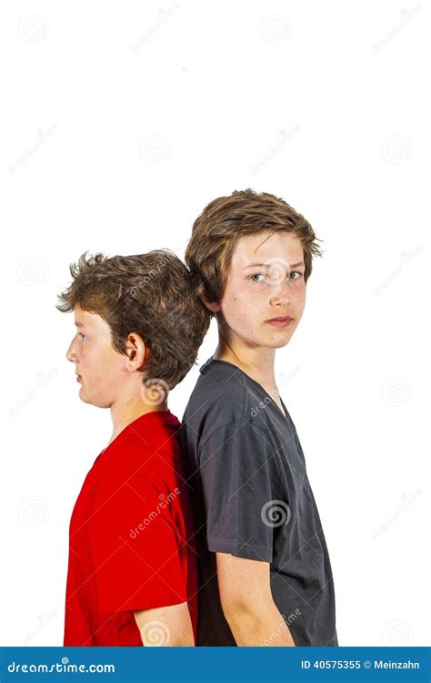 Portrait Of Two Boys Standing Back To Back Stock Image Image Of Face