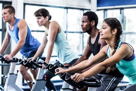 Fit People Working Out At Spinning Class Stock Photo - Image of active ...