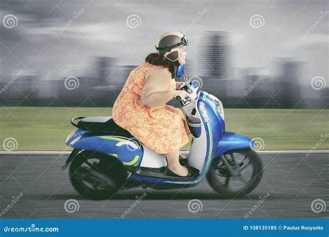 Obese Woman Driving A Scooter With High Speed Stock Image Image Of