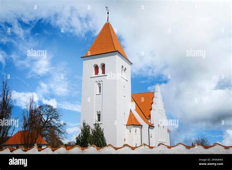 White church in nordic design behind a wall with a beautiful heaven ...