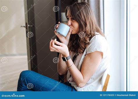 Attractive Brunette Siting With White Cup In Kitchen Near Window Stock Image Image Of Cute