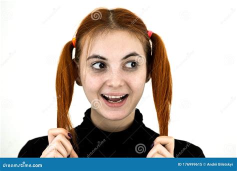 Close Up Portrait Of Pretty Redhead Teenage Girl Fooling Around Stock