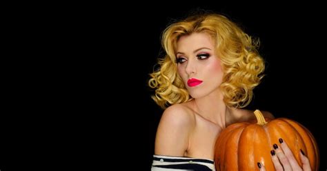 Premium Photo Happy Halloween Serious Blonde Girl With Jackolantern Pumpkin Sexy Woman In