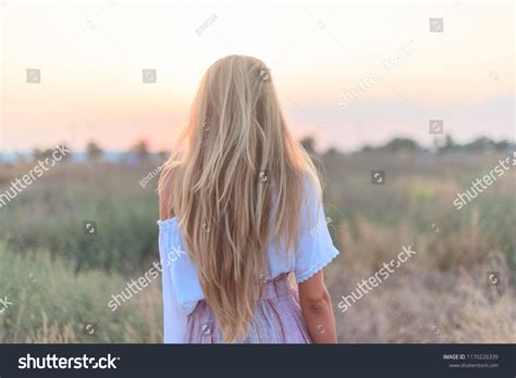 Стоковая фотография 1170226339 Back View Beautiful Blonde Girl Long