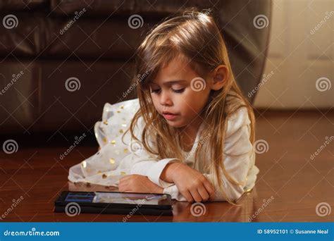 Sweet 4 Year Old Girl In White Playing With Ipad Stock Image Image