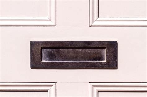 Premium Photo Olished Steel Letterbox On A White Wooden Front Door