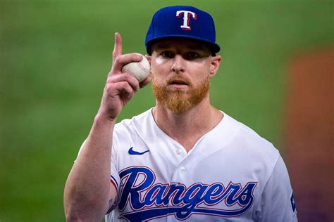 Download Jon Gray Holding Up Ball Wallpaper | Wallpapers.com 