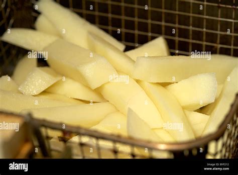Raw Sliced Cut Home Made Chips From Fresh Potatoes Stock Photo Alamy
