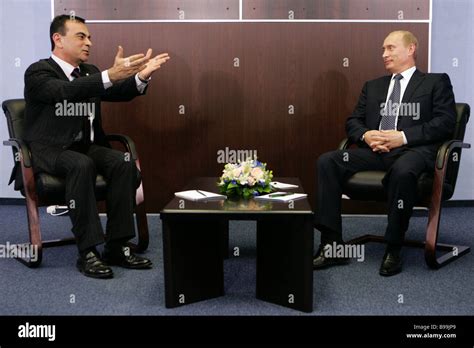 Nissan Motor CEO Carlos Ghosn and Russian President Vladimir Putin left