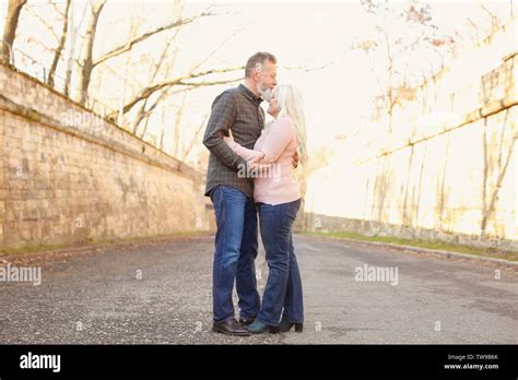 Happy Mature Couple Hugging Outdoors Stock Photo Alamy