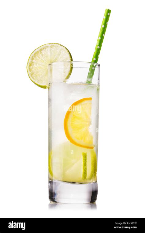 Tonic: water with lemon and lime in a clear glass, isolated on white ...