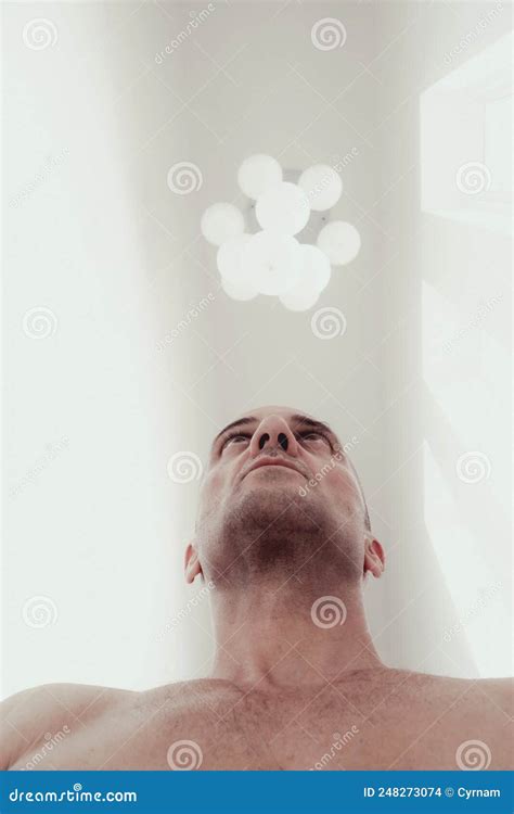 Low Angle View Of A Strong Man With Naked Torso In A White Room Stock Photo Image Of Hospital