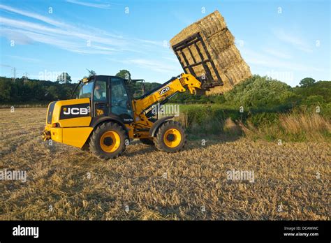 Farmer With Bales Of Straw Hi Res Stock Photography And Images Alamy