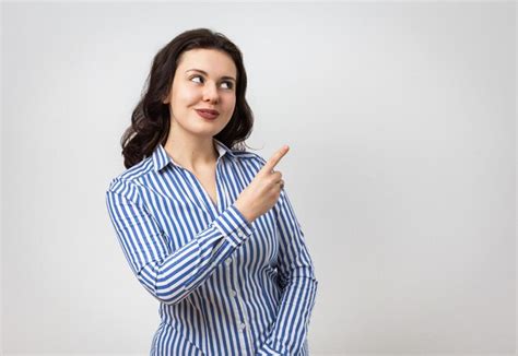 Premium Photo Cute Smiling Brunette Girl Pointing Up