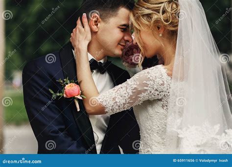 Happy Sensual Handsome Groom And Blonde Beautiful Bride In White Stock Photo Image Of Natural