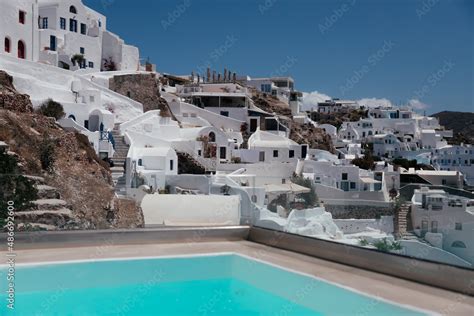 Beautiful infinity pool with view in Santorini, Oia town, Greece. White ...