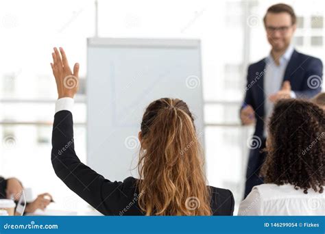 Training Participant Raise Hand Ask Question At Employees Team Workshop