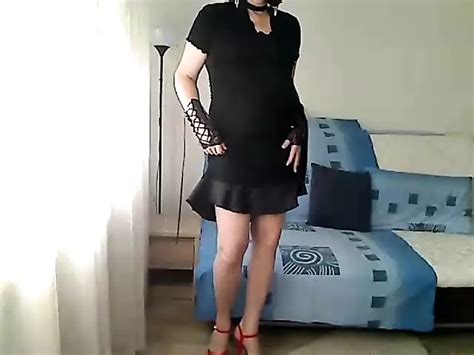 Horny MILF Tranny Shows Off Her Body In A Black Satin Dress Bare Slender Legs Thong And Red