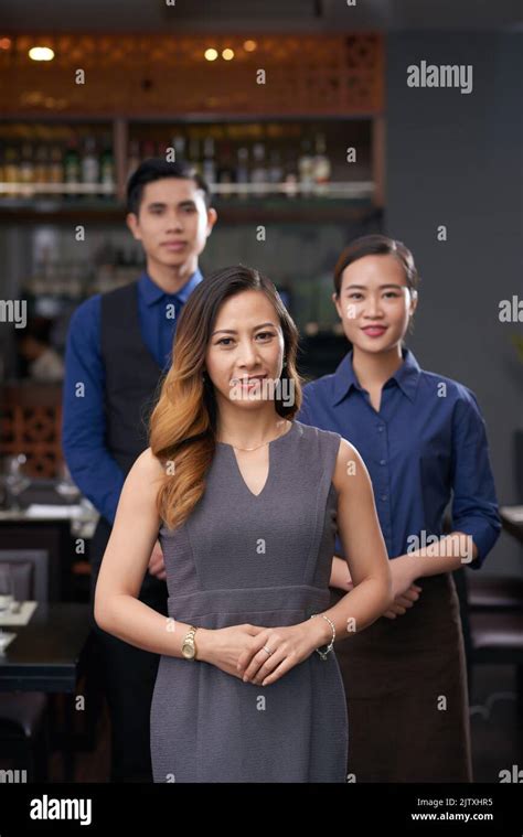 Cheerful Female Bar Owner And Her Employees Stock Photo Alamy