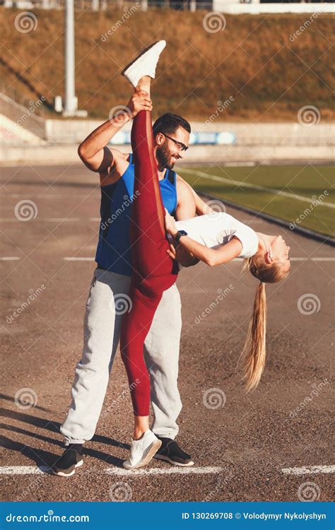 Bearded Man Help Stretching To His Blonde Girlfriend Stock Photo Image Of Flexibility Lovely