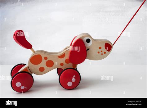 Pull along wooden dog toy Stock Photo - Alamy