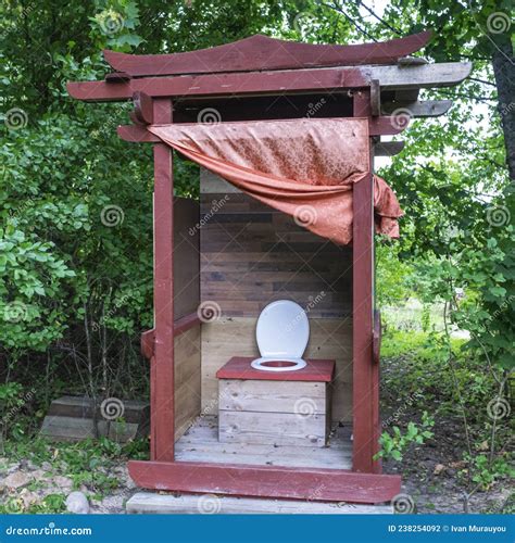 Unusual Rustic Wooden Toilet In The Form Of A Pagoda Without Door Stock