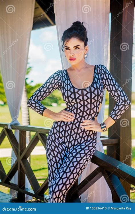 Latina With Long Black Hair In Tight Jumpsuit Stock Photo Image Of Outdoors Design