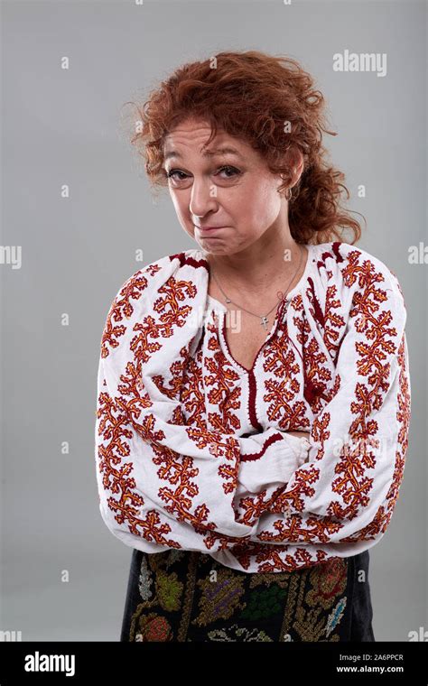 Mature Romanian Woman In Traditional Costume On Gray Background Stock Photo Alamy